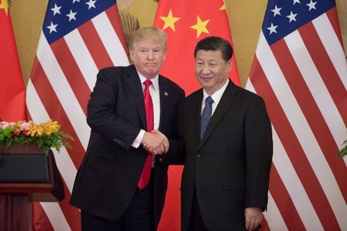 Tangkapan foto Xi Jinping dan Donald Trump. (Sumber: AFP/Nicolas Asfouri)